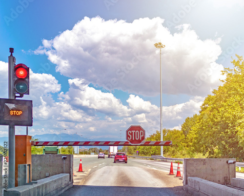 Automatic road barrier, stop, concept: toll road, boom barrier