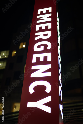 Big red emergency neon banner at night