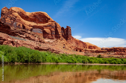 Water view from the Colorado River along the bluffs and rock sculpture outside Moab, Utah