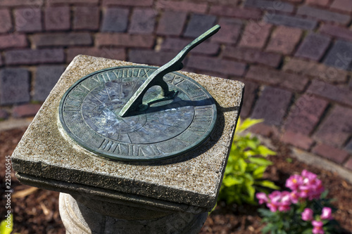 End of summer sundial in garden.