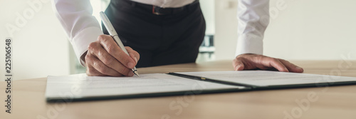 Businessman signing contract photo