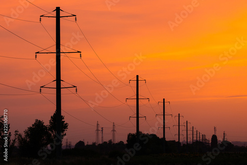 Obraz na płótnie Rural landscape with high-voltage line on sunset w salonie