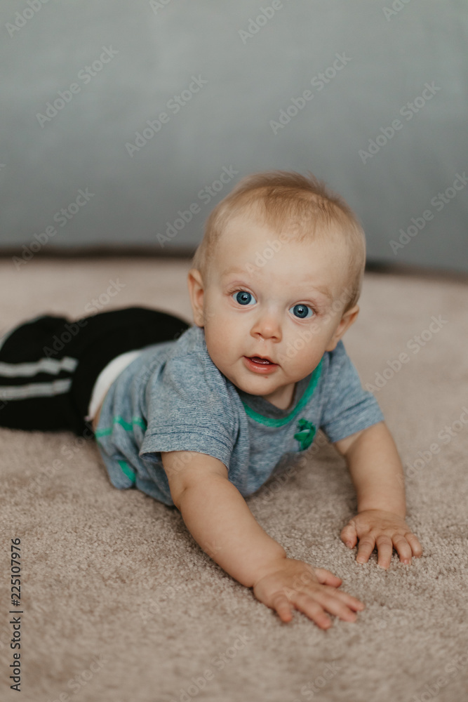 Cute Adorable Little Baby Boy Having Fun During a Photoshoot Cute Adorable Little Baby Boy Having Fun During a Photoshoot