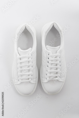  flat top photographed female flat sport sneaker shoes on a white background