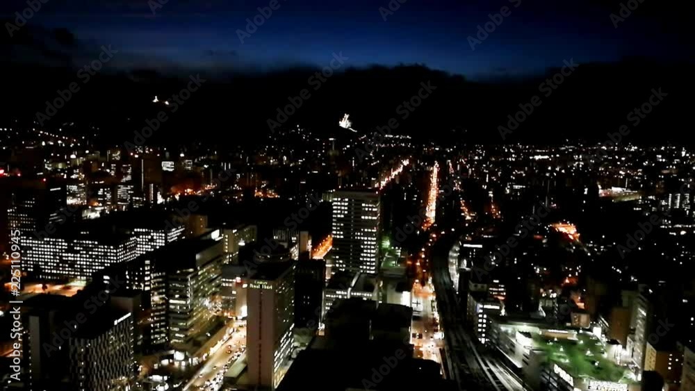 Night aerial time-lapse in Sapporo Hokkaido during winter with moving cloud, cars and train
Night aerial time-lapse in Sapporo Hokkaido during winter with moving cloud, cars and train