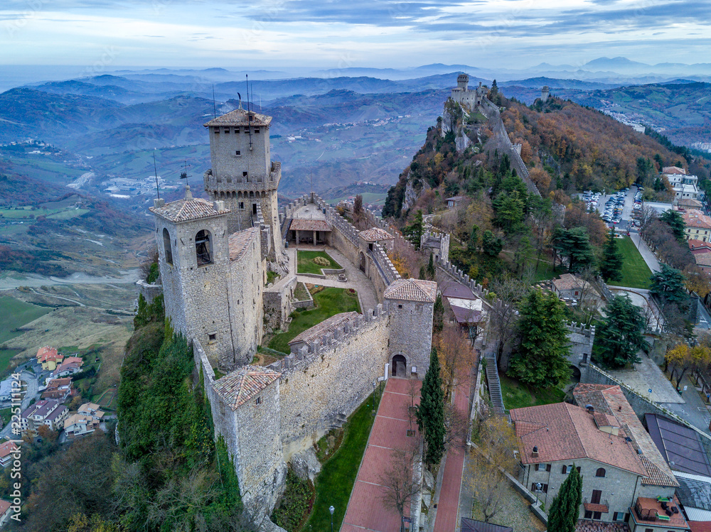 San Marino aerial city scape with castles, walls, towers, houses and red rooftops 