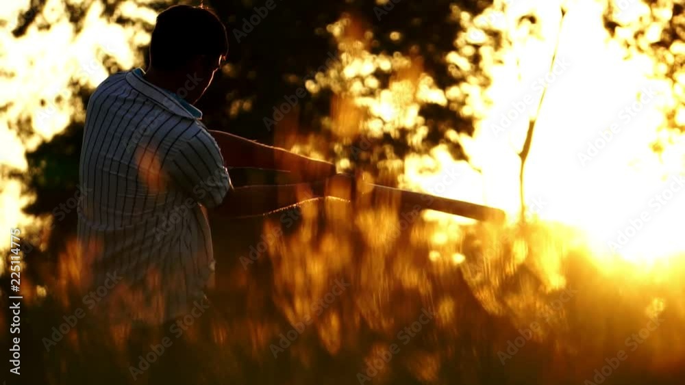 Men are hitting the baseball player with the sunset footage slow motion