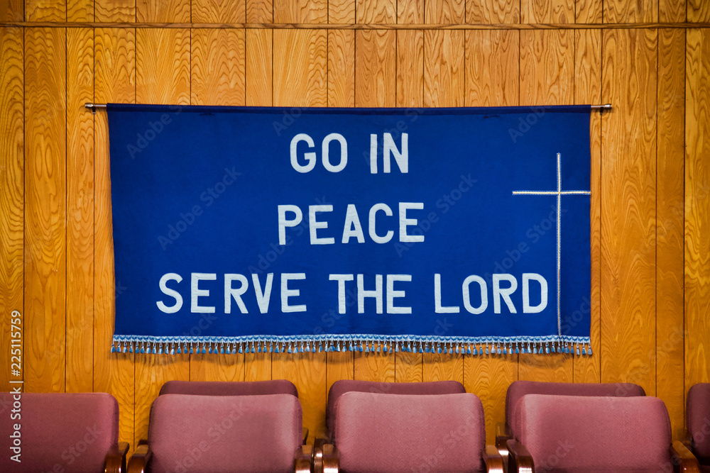 go-in-peace-serve-the-lord-written-on-dark-blue-cloth-with-white