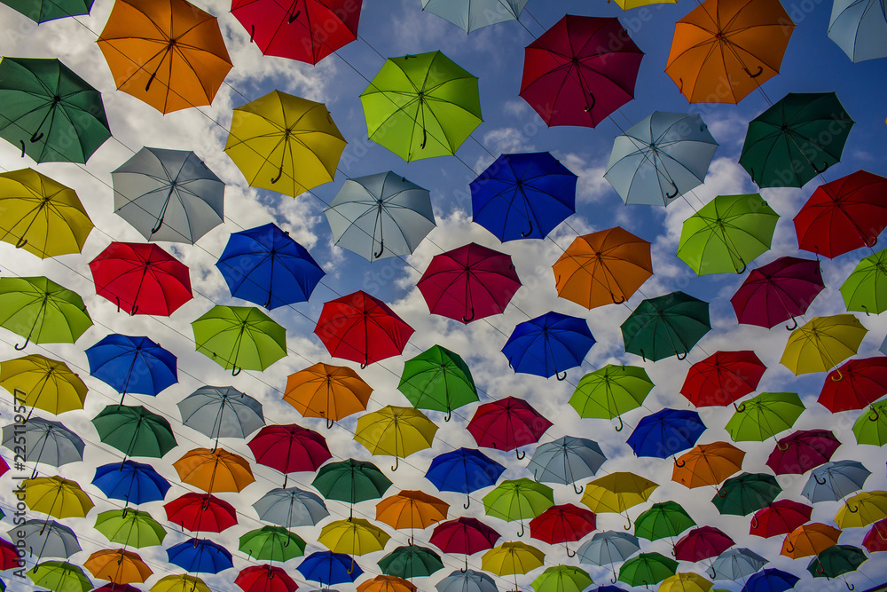 multicolored hanging umbrellas against the blue sky multicolored hanging umbrellas against the blue sky