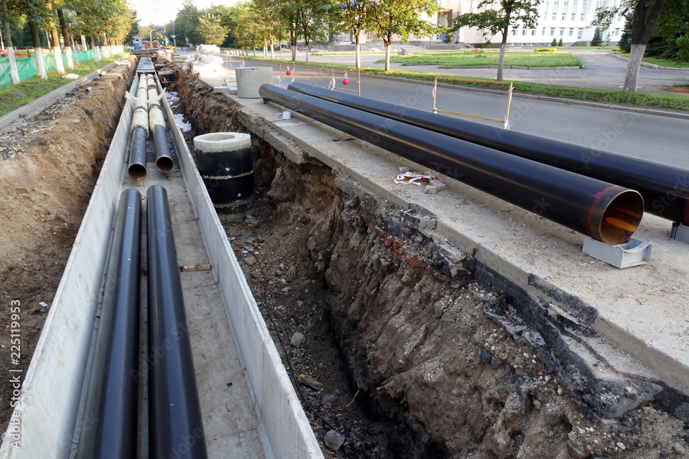 Replacement pipes in the city.Construction of heating mains for municipal infrastructure, the concept of city development.