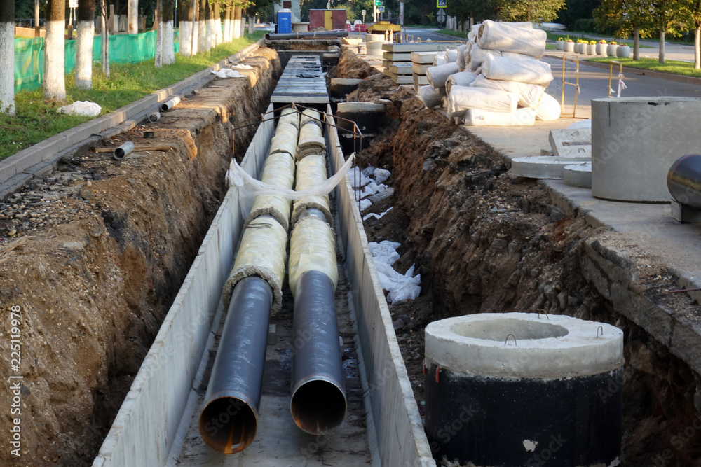 Replacement pipes in the city.Construction of heating mains for municipal infrastructure, the concept of city development. Replacement pipes in the city.Construction of heating mains for municipal infrastructure, the concept of city development.