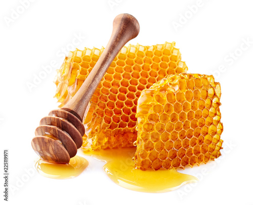 Fototapet Honeycomb with honey on white background