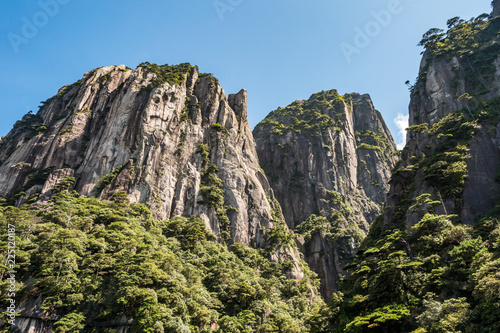 stunning rock formation at the peaks of Mount SanQiang on a sunny day