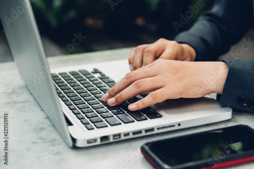 Business woman using his computer laptop on © sorapop
