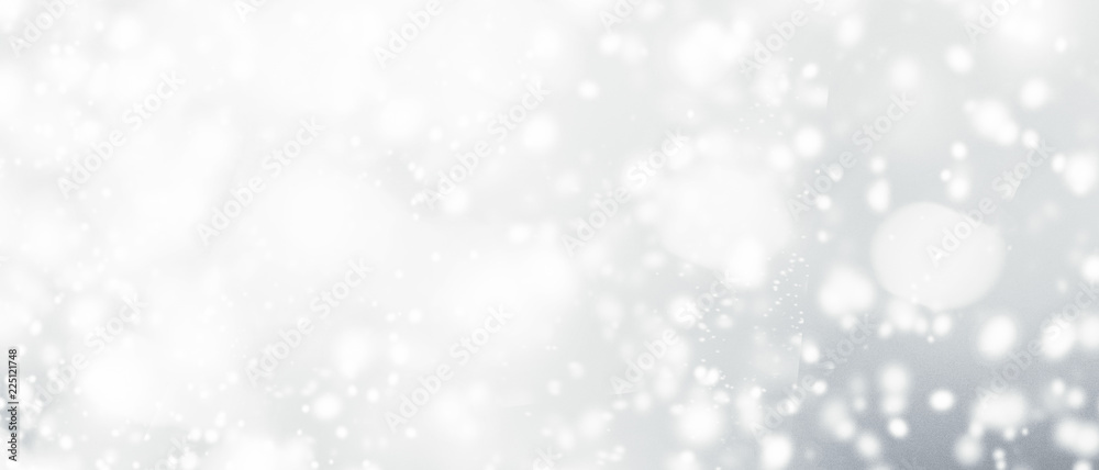 Silver abstract bokeh background with snowflake and white glittering bokeh stars. A shiny holiday card. Glowing blurred lights. Silver abstract bokeh background with snowflake and white glittering bokeh stars. A shiny holiday card. Glowing blurred lights.