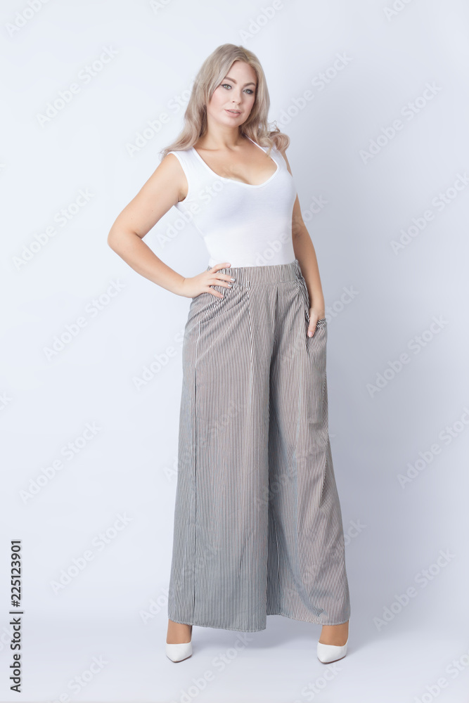 Full length portrait of cheerful blonde woman Full length portrait of cheerful blonde woman