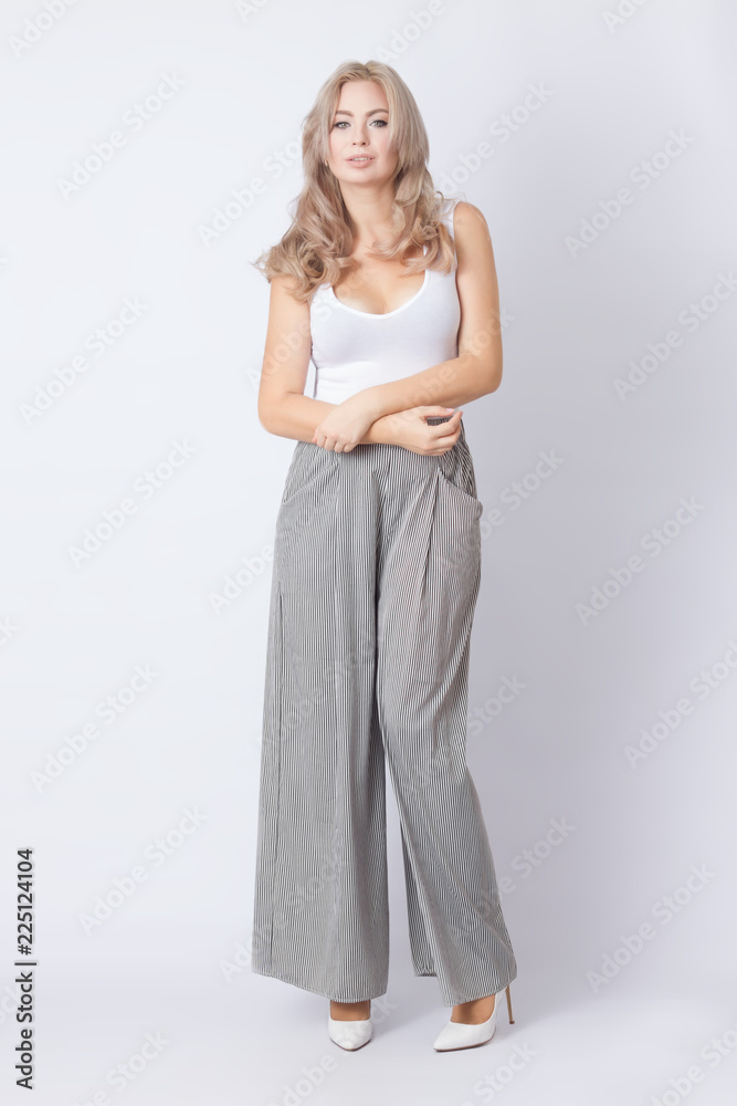Full length portrait of cheerful blonde woman Full length portrait of cheerful blonde woman