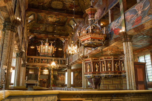 Interior of a wooden church with an organ © Lars Johansson