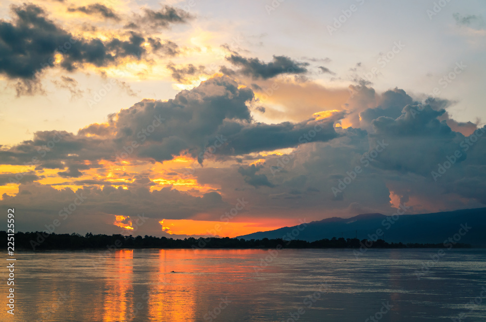 Scenic view of Mekong river against sky during sunset image Scenic view of Mekong river against sky during sunset image