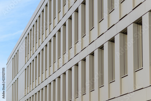 Wide rectangular concrete building with windows