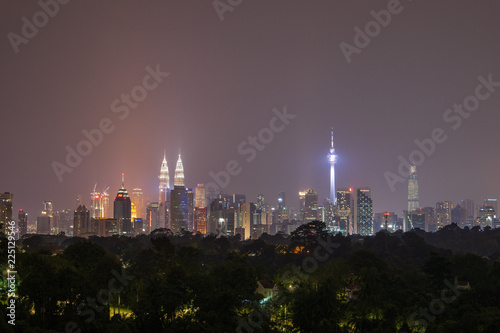 Kuala Lumpur  Malaysia - 30 September 2018. Kuala Lumpur cityline nightscape with blue sky.
