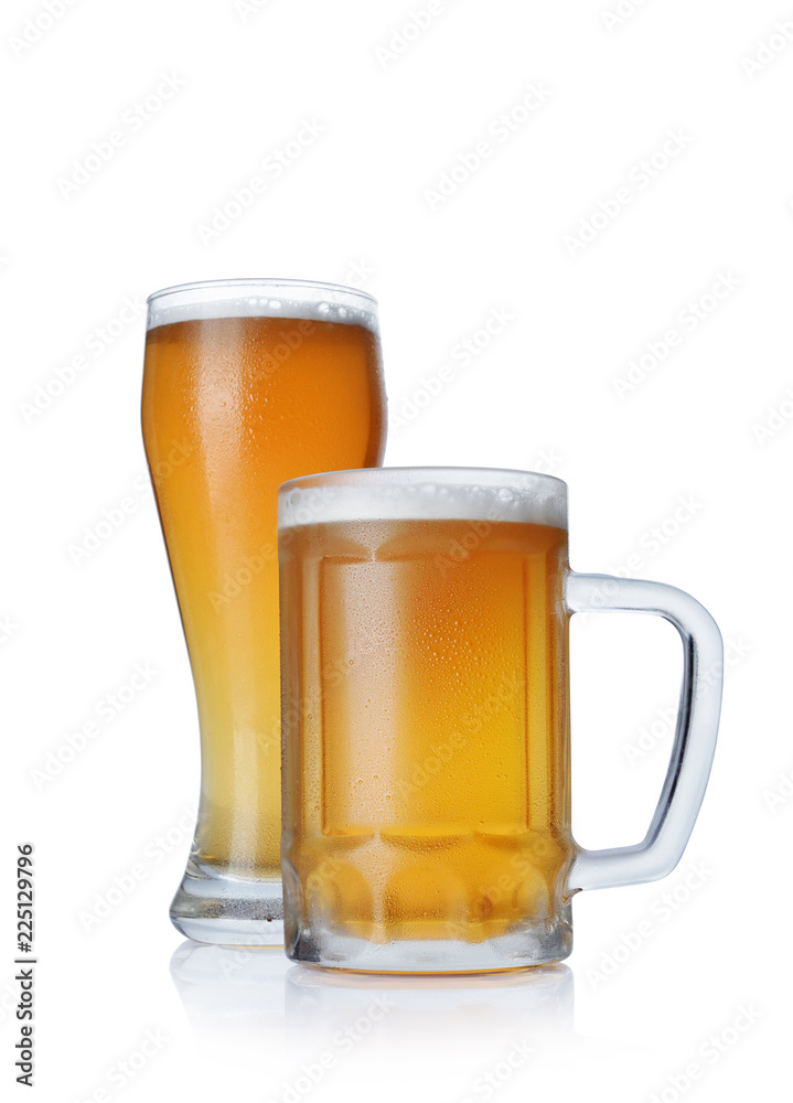 Glass and mug of cold light beer with foam Glass and mug of cold light beer with foam