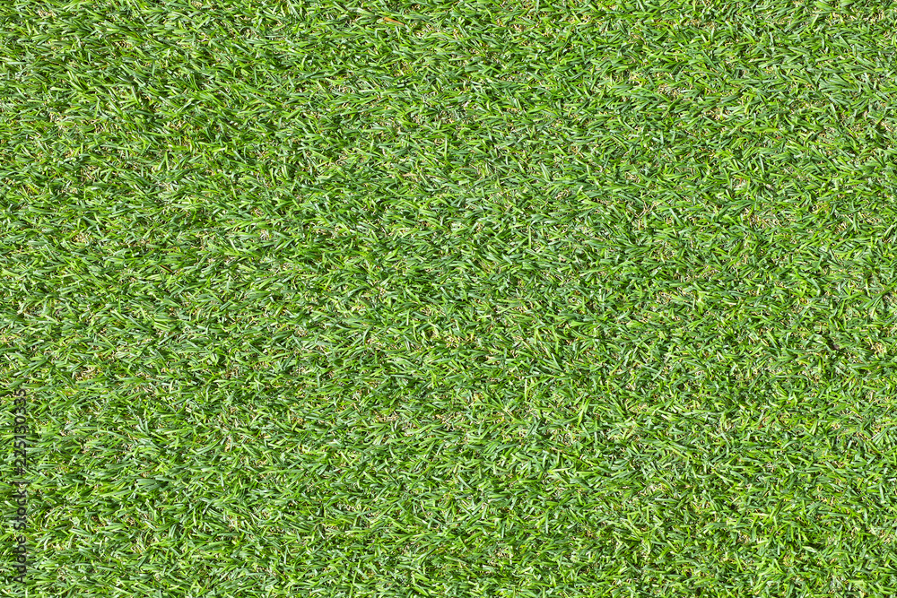 Fototapeta premium Green grass field texture top view artificial grass use us sport stadium or construction decor natural concept background