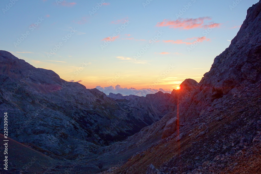 Sunrise on a hiking trail leading to the top of mount Triglav in Triglav national park, Julian Alps, Slovenia