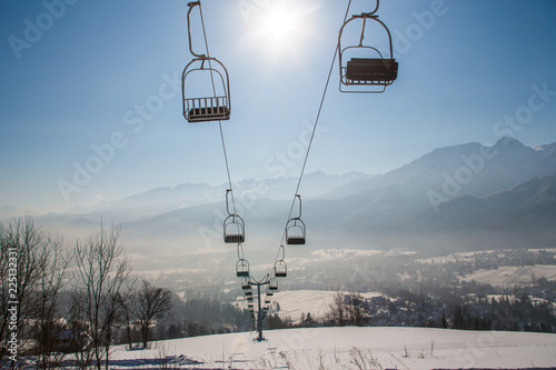 Winter ski resort Zakopane. Chairlift from Butorowy Wierch in Zakopane, Tatra Mountains photo