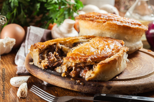 Fresh beef stew pie on a cutting board
