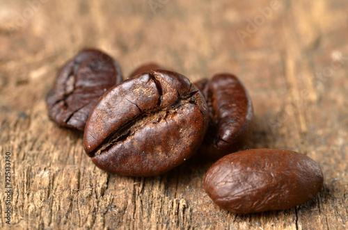 Close-up of coffee beans on a wooden table