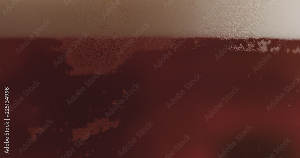 closeup pouring ale beer in a glass