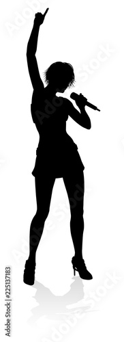A woman singer pop  country music  rock star or even hiphop rapper artist vocalist singing in silhouette