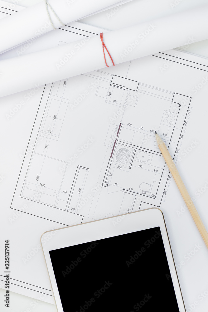 Interior designer table workplace with house plan Interior designer table workplace with house plan