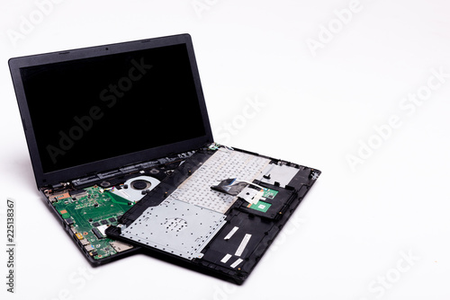 disassembled laptop on a white background, laptop repair, details of a laptop