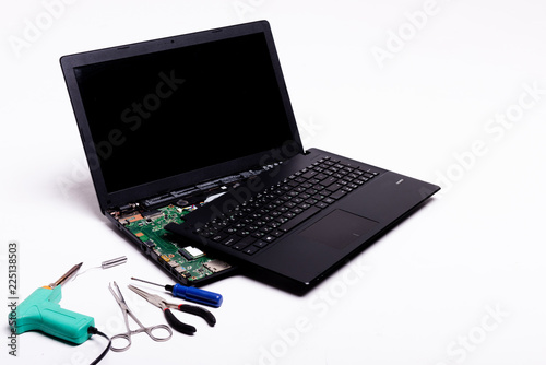 disassembled laptop on a white background, laptop repair, details of a laptop