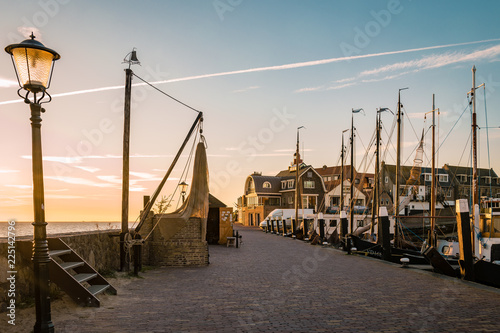 harbor of urk netherlands during sunset on a cold autumn day in Urk Flevoland  photo