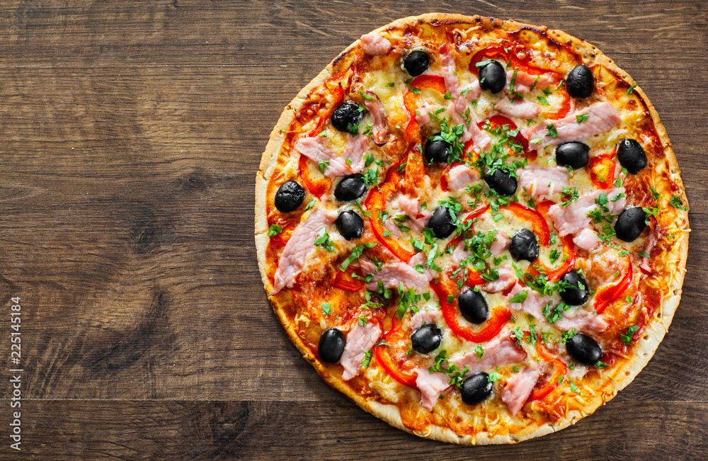 Pizza with Mozzarella cheese, ham, pepper, meat, Tomatoes, olives, Spices and Fresh Basil. Italian pizza on wooden background Pizza with Mozzarella cheese, ham, pepper, meat, Tomatoes, olives, Spices and Fresh Basil. Italian pizza on wooden background