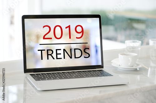 Laptop computer with 2019 trends on screen background, digital marketing, business and technology concept