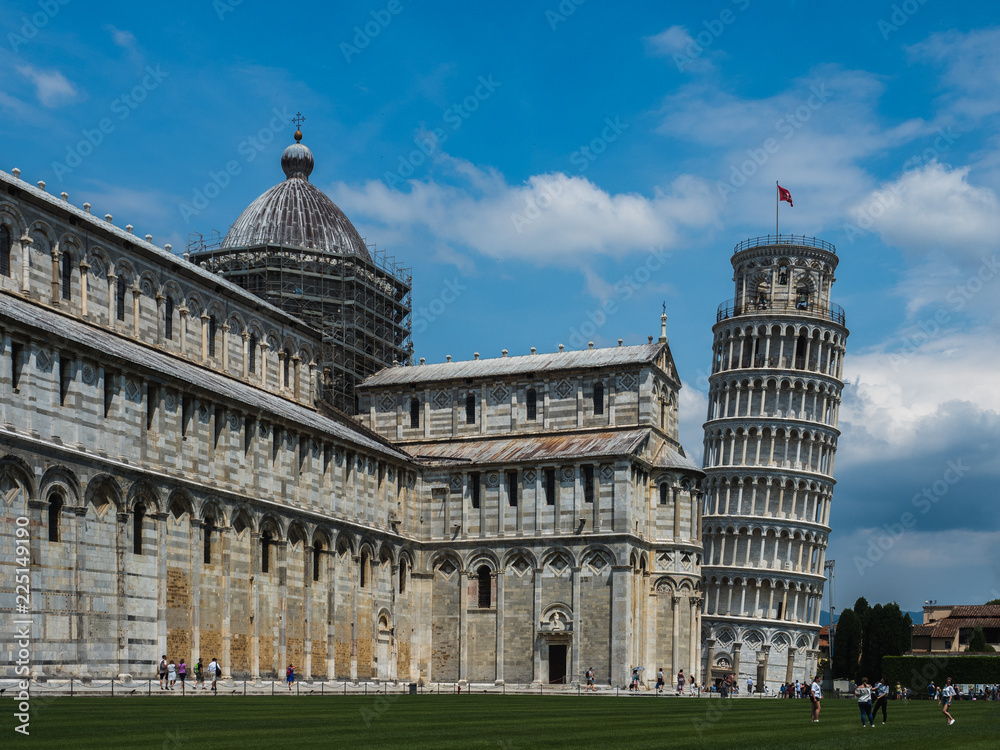 Famous Leaning Tower of Pisa against the blue, clear sky. Travel and vacation concept