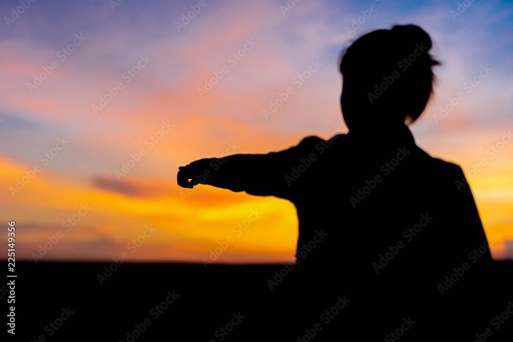 Silhouette women point to success at not far away.