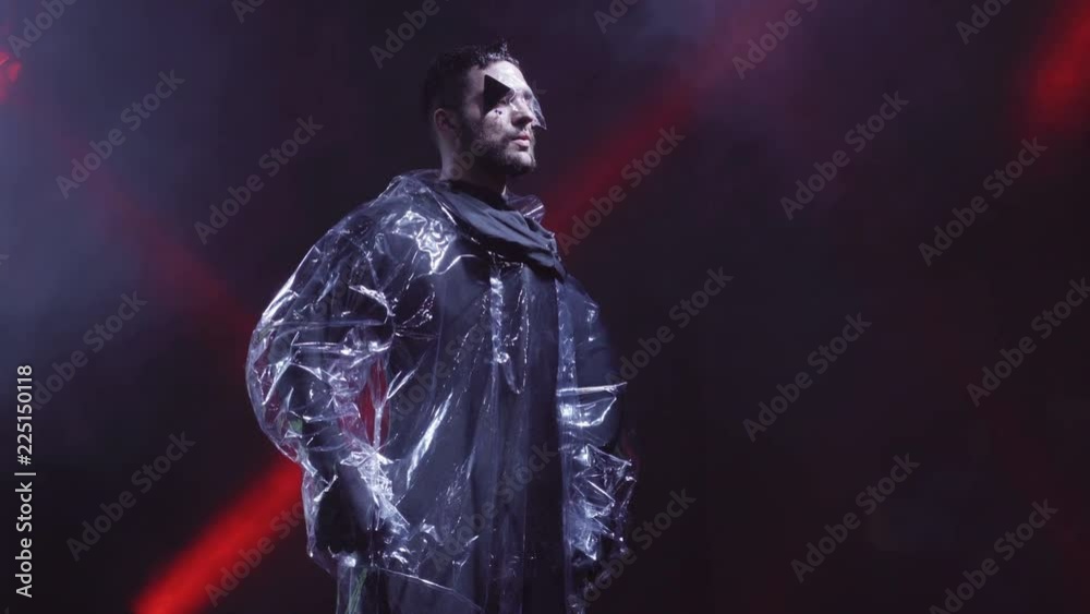 man in futuristic costume is dancing at the nihgtclub' s scene man in futuristic costume is dancing at the nihgtclub' s scene