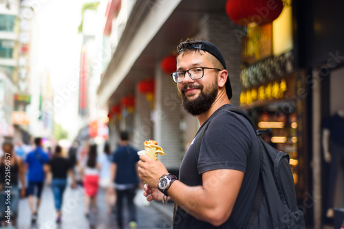 Foreigner eating Chinese street food