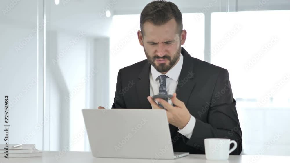 Angry Businessman Yelling on Phone, Financial Loss Angry Businessman Yelling on Phone, Financial Loss