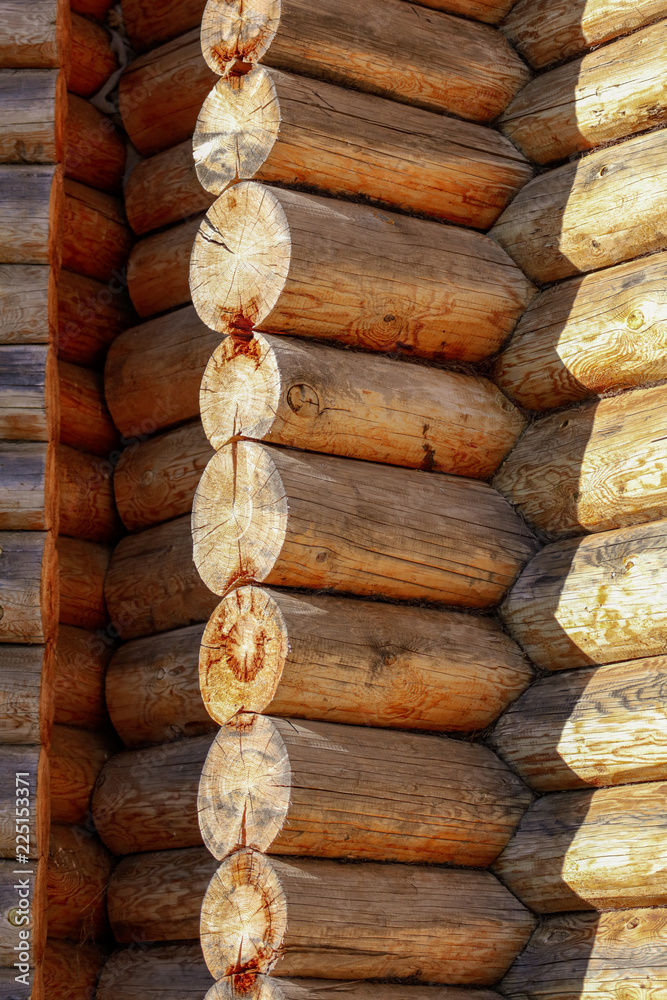 Wall with log house in the house as a background Wall with log house in the house as a background