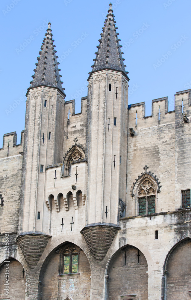 Exterior design architecture of Papal palace (Palais des papes) under clear blue sky in Avignon, France Exterior design architecture of Papal palace (Palais des papes) under clear blue sky in Avignon, France