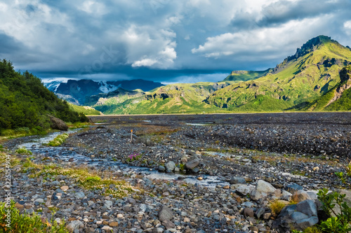 Glacial river in the dramatically beautiful and surreal landscapes of Thorsmork valley in the Highlands of Iceland at southern end of the famous Laugavegur hiking trail. photo