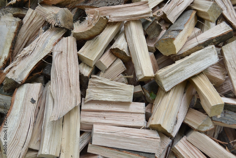 Closeup photograph of a pile of freshly cleaved firewood (oak and beech). Closeup photograph of a pile of freshly cleaved firewood (oak and beech).