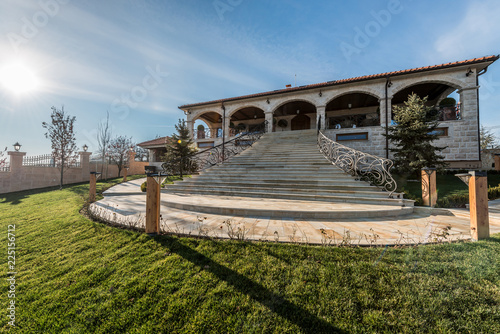 Curved masive staircasise of luxury mansion photo