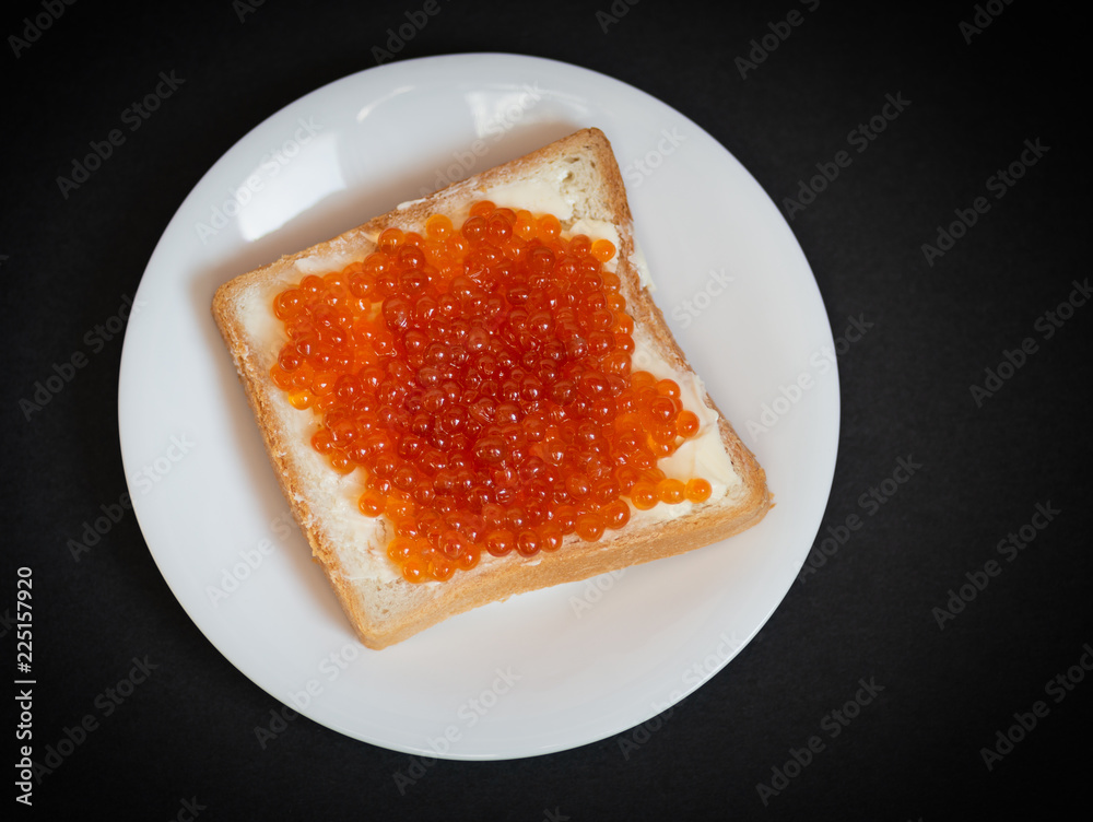 Sandwich with red caviar. Selective focus. Sandwich with red caviar. Selective focus.